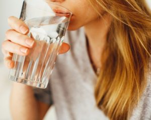 Tips for drinking more water - drink a cup first thing in the morning