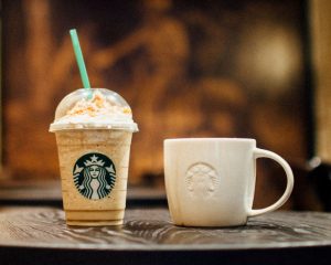 Picture of a starbucks frappucino and cup of coffee. - small diet changes to lose weight